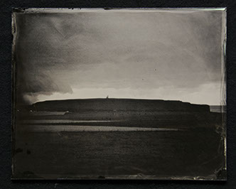 Panel B1 is a glass photo depicting a landscape. The composition is 1/2 bright clouds with dark edges. The other 1/2 dark fertile land of hills.